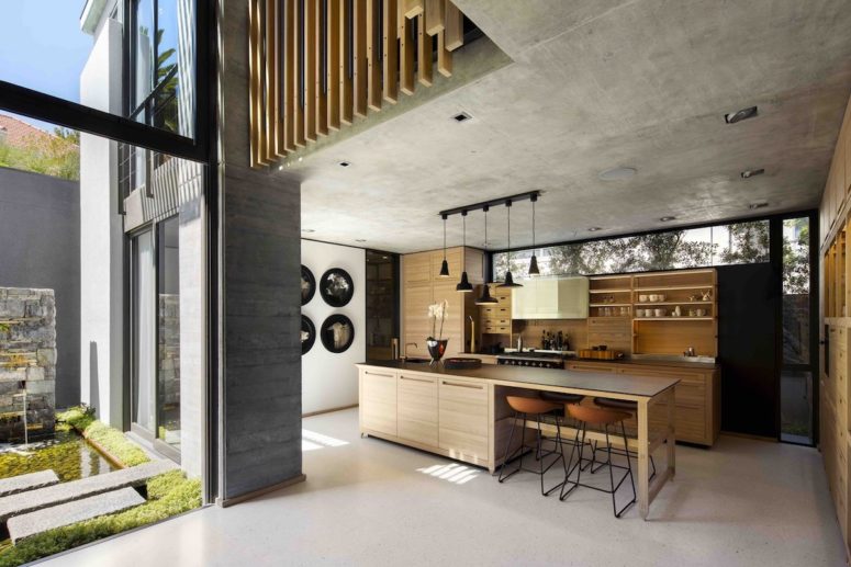 The interior is organized into three blocks, each with its own connection to the outdoors