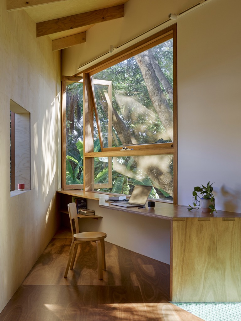 The upper floor is taken by a small yet comfortable home office with a glazed wall, which provides cool views and inspires working