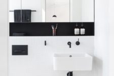 05 an ultra-modern space with small white tiles, black fixtures and a built-in shelf