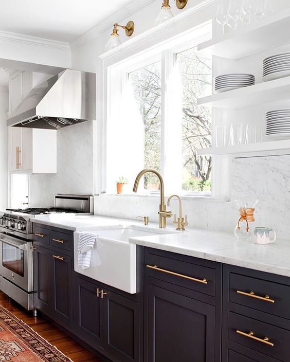 brass touches add glam to the kitchen, and a stainless steel hood looks organic too