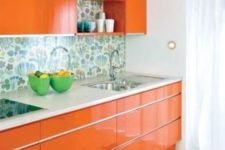 05 modern orange kitchen with a floral backsplash looks cute and cheerful