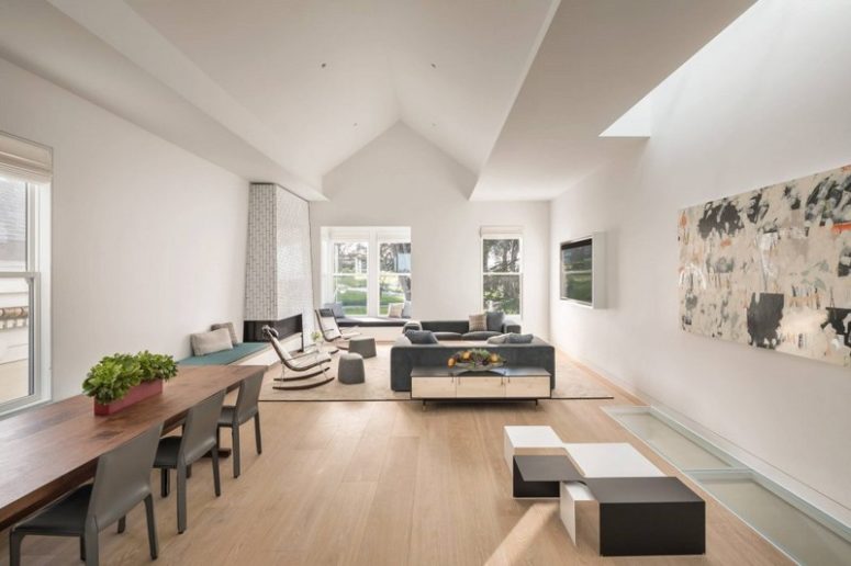Another living room is combines with a dining space, there's unique modern furniture that catches an eye