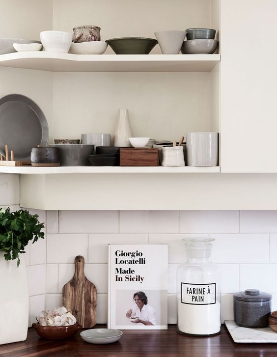 The shelves show off a ceramics collection gathered by one of the owners