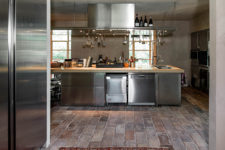 07 The kitchen is stainless steel, with concrete and brick floors, which altogether create a cool industrial feel