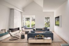 07 There’s modern furniture, a hearth, modern chairs and cool views that are kep visible as there are no curtains