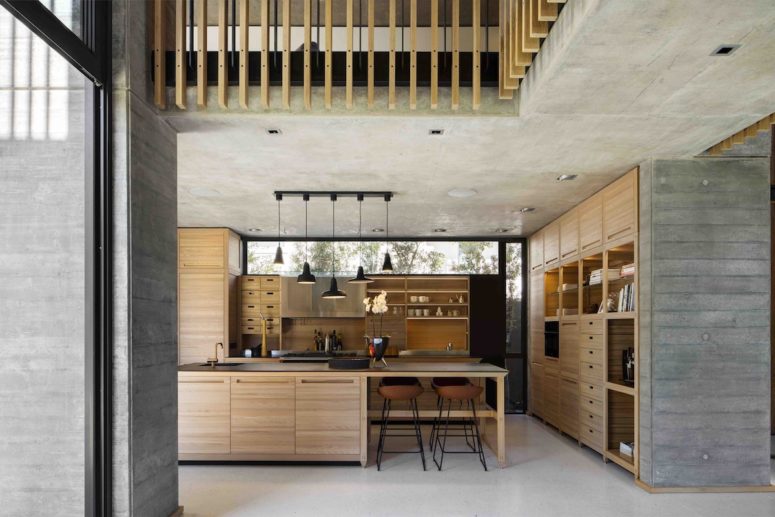 The kitchen has a clerestory window that brings natural light inside without taking up valuable space on the wall