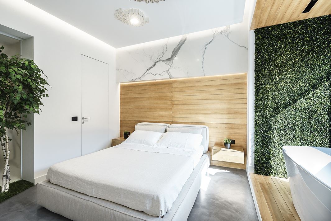Touches of natural wood add to the relaxing nature of the bedroom