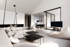 08 a chic neutral space with a black fireplace and tables and glazed walls to connect with other spaces