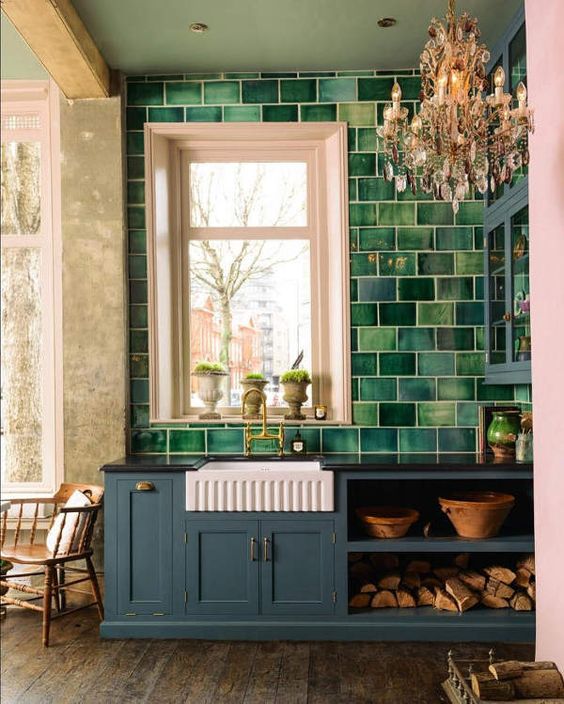 a grey kitchen with a large scale green tile backsplash extended on the whole wall