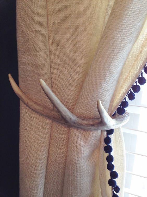 antler curtains holdbacks will effortlessly add a rustic feel to the space