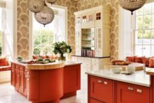 09 eye-catchy kitchen with burnt orange cabinets and a unique kitchen island