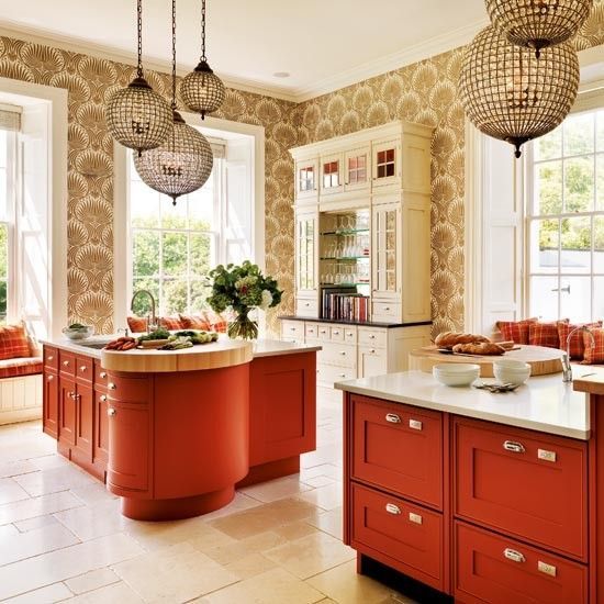 eye-catchy kitchen with burnt orange cabinets and a unique kitchen island