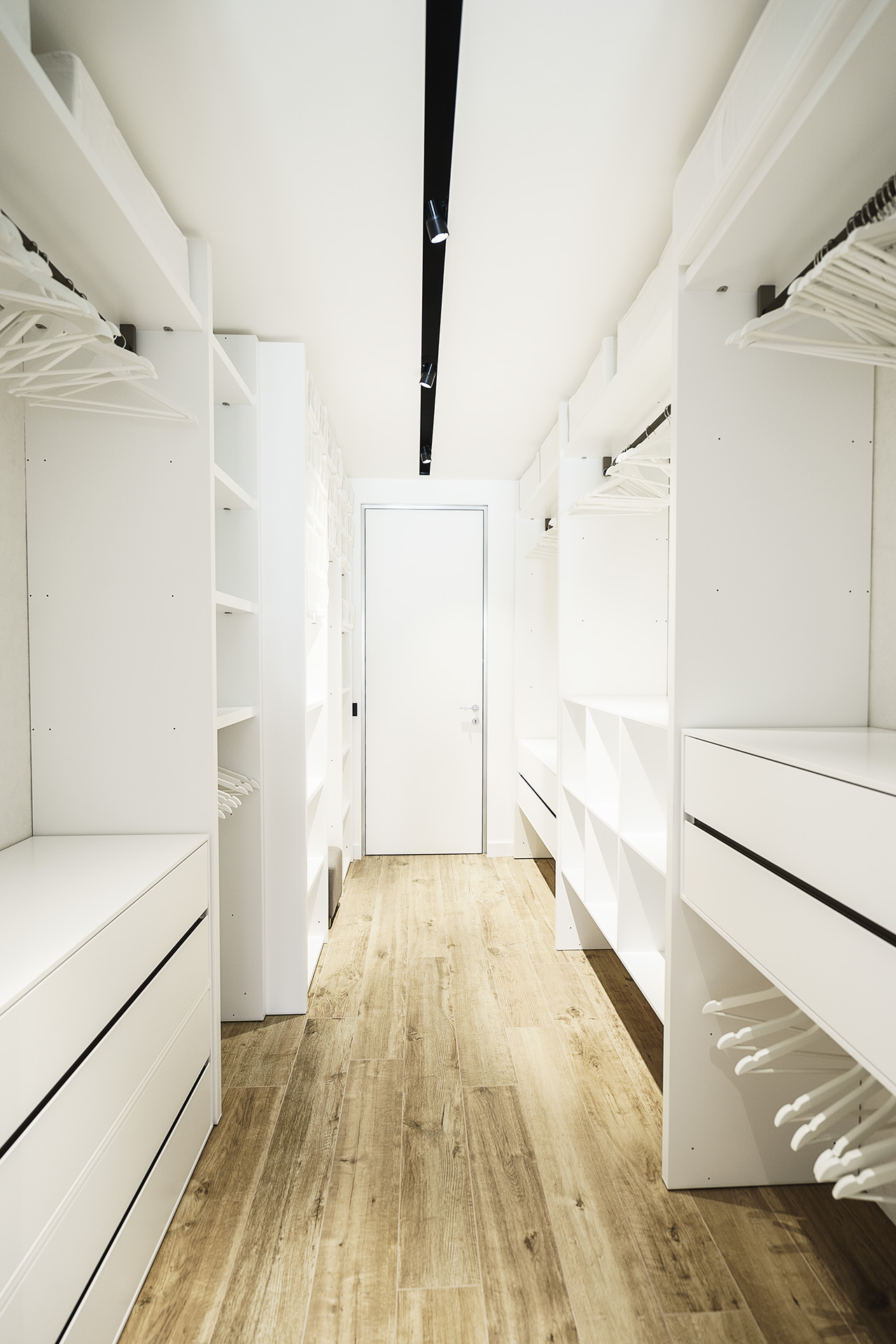 The closet is spacious and well organized, it's done in pure white