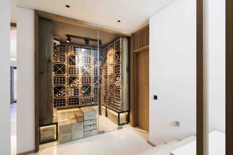 There’s a separate space that serves as a wine cellar. It has racks all the way up to the ceiling