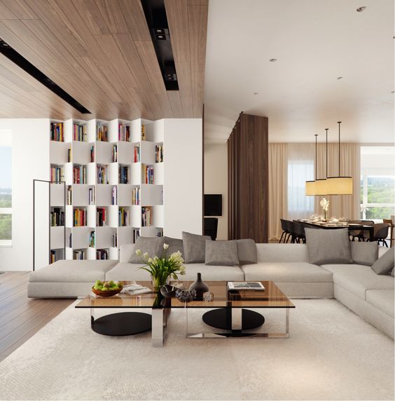 a modern neutral space with a wood clad ceiling, an eye-catchy storage unit and a chic glass table