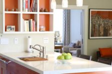 12 a burnt orange kitchen island and lining of the shelf for a cheerful touch