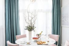 12 chic pink chairs add color to this glam dining space
