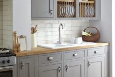 12 vintage grey kitchen is softened with wooden countertops and a subway tile backsplash makes it more eye-catchy
