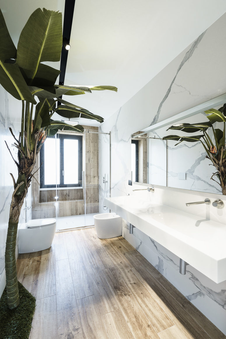 The floating vanity contributes to the roominess of the bathroom