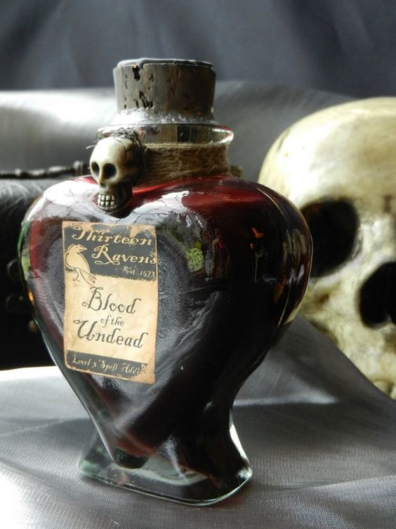 a beautiful blood bottle with twine and a skull can hold some faux blood or even tomato juice