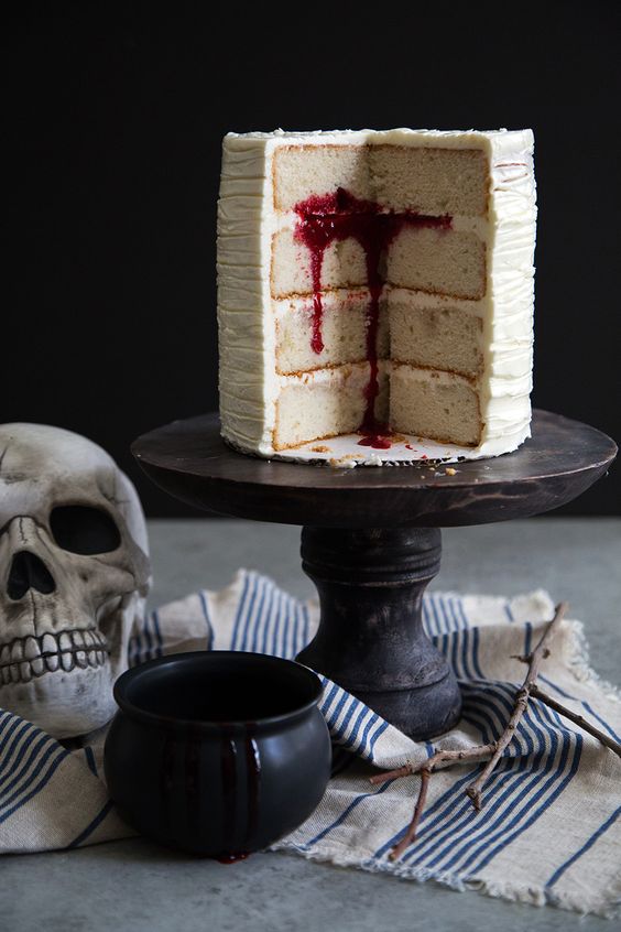 a four layer vanilla cake with Swiss buttercream and raspberry coulis is great for a vampire party