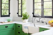 16 a farmhouse kitchen is added impact with bold sage green color of the cabinets