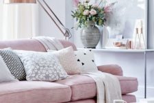 17 a pink sofa is a perfect piece for a feminine living room, and a copper table and lamp complete the look