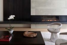 17 modern aesthetics with concrete, black wood, various textiles and a chic coffee table