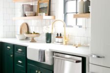 20 bold emerald cabinets add a colorful touch to this neutral space and contrast the white tiles
