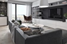 22 a monochrome black and white living room with a large setional sofa and a wall storage unit