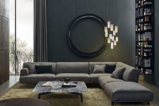 23 a moody living space with dark walls, cool lights cluster and comfy textural textiles