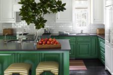 24 bright green cabinets and a kitchen island are balanced with white cabinets and a backsplash