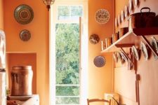 24 orange walls are a nice idea to make a traditional kitchen non-boring