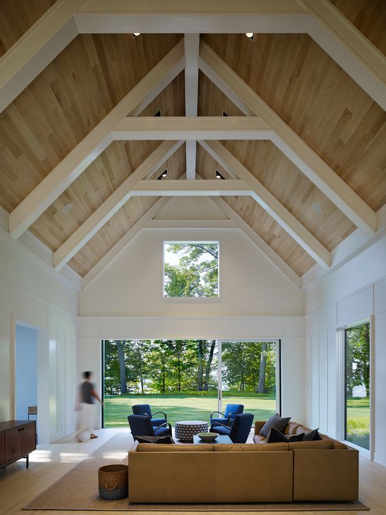 a high vaulted ceiling requires more heating or cooling, and changing bulbs up there is difficult
