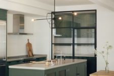 25 dark green cabinets and a kitchen island with modern lights and a glass pantry for a modenr space