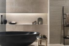 26 a modern luxurious bathroom with beige tiles, a black tub and wooden accents that create a spa feel