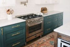 26 dark green cabinets contrast white cabinets and tiles and create a chic vintage-inspired kitchen