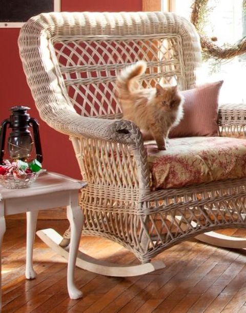 a whitewashed wiecker rocker brings coziness and a vintage feel to the space