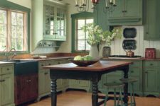 29 pale green vintage-kitchen is made cozier with wooden beams and an antique dining table