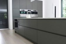 29 sleek minimalist grey kitchen with a large kitchen island and all the rest done in white for a fresh look