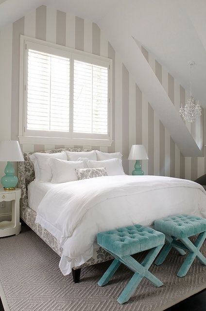 a soft-looking guest bedroom with white as the main color, light grey as additional and a couple of turquoise accents
