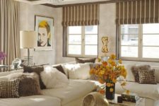 ivory is the main color in this luxurious space, brown is added for a contrast, and yellow is an accent