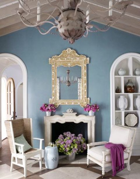 white and grey and the main shades here, and they are completed with a blue wall and fuchsia touches