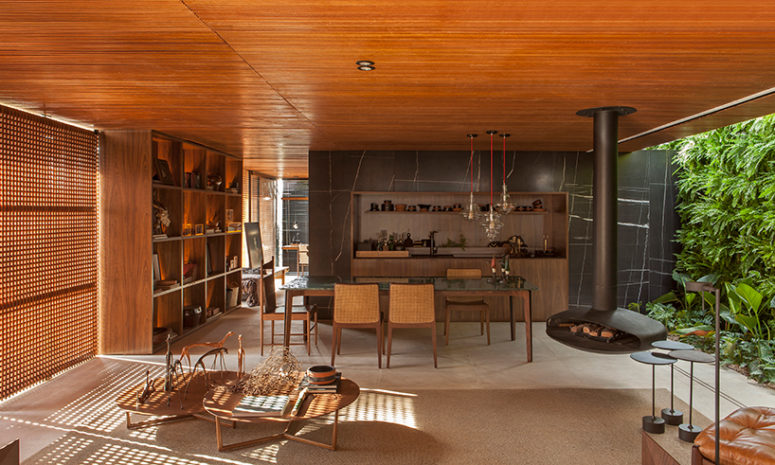 This gorgeous open layout is a part of a Brazilian home, done with wood, marble stone and in an earthy color palette This gorgeous open layout is a part of a Brazilian home, done with wood, marble stone and in an earthy color palette