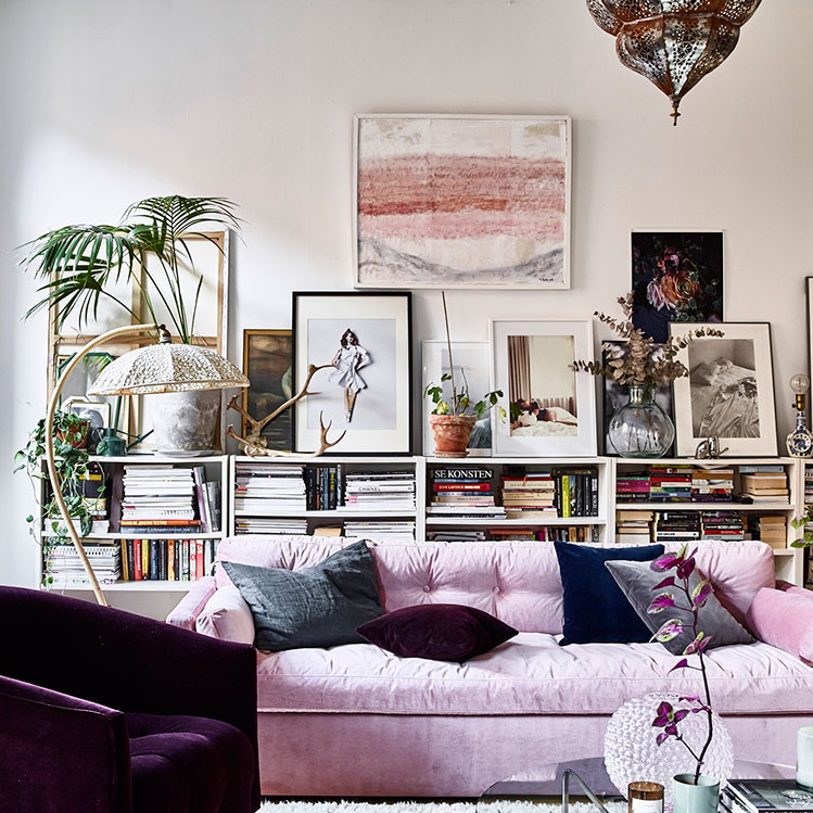 This space injected with color is part of a Scandinavian home with lots of vintage finds and potted plants