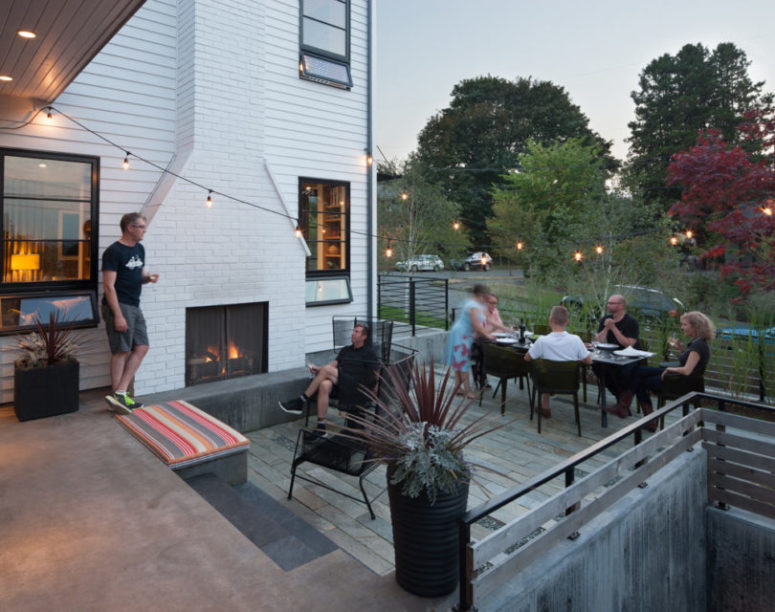 cool terrace made with reclaimed wood A cozy terrace clad with reclaimed wood is a cozy space for welcoming guests and there's even a hearth