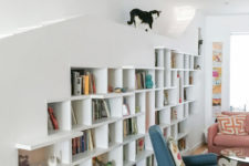 02 The main piece is a large bookcase, with artworks and books, plus some cat paths