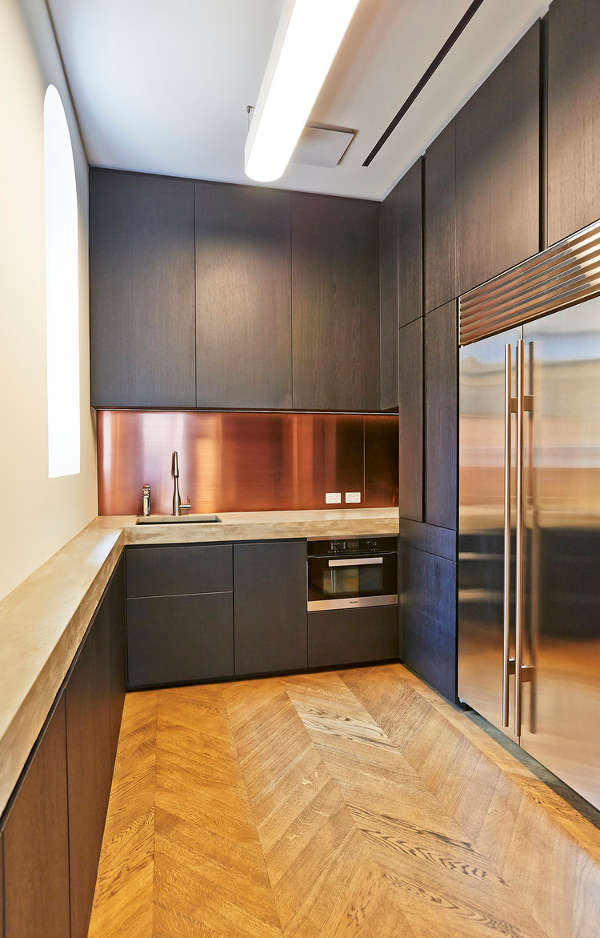 Concrete countertops make the kitchen calmer and not too glam, besides they are functional