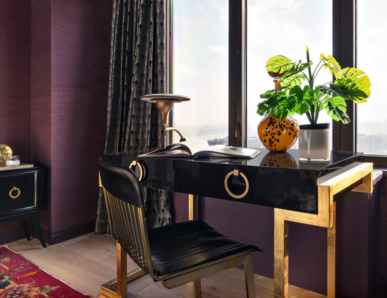 The black and gold geo desk is another eye-catchy feature here, and the chair is matching