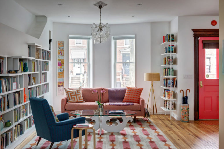 The furniture and textiles are colorful, printed and bold for a chic space
